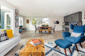 Open concept living and dining area with modern furniture